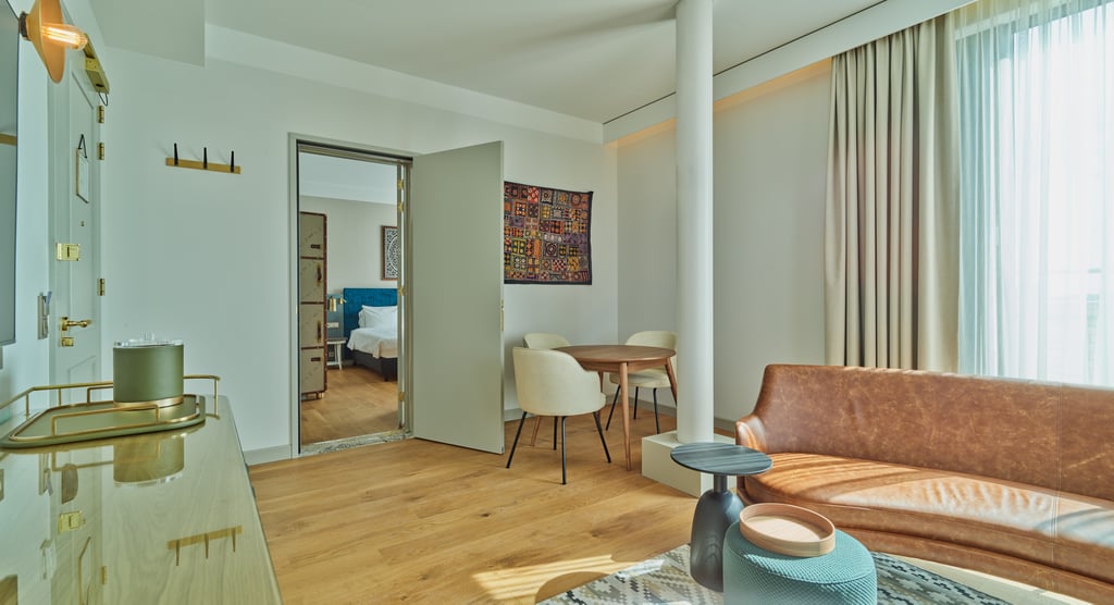 Livingroom with table and sofa in meeting suite