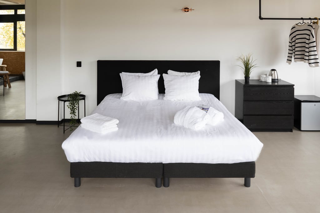 Urban Hotel The Golden Stork - Large Room Beds.jpg