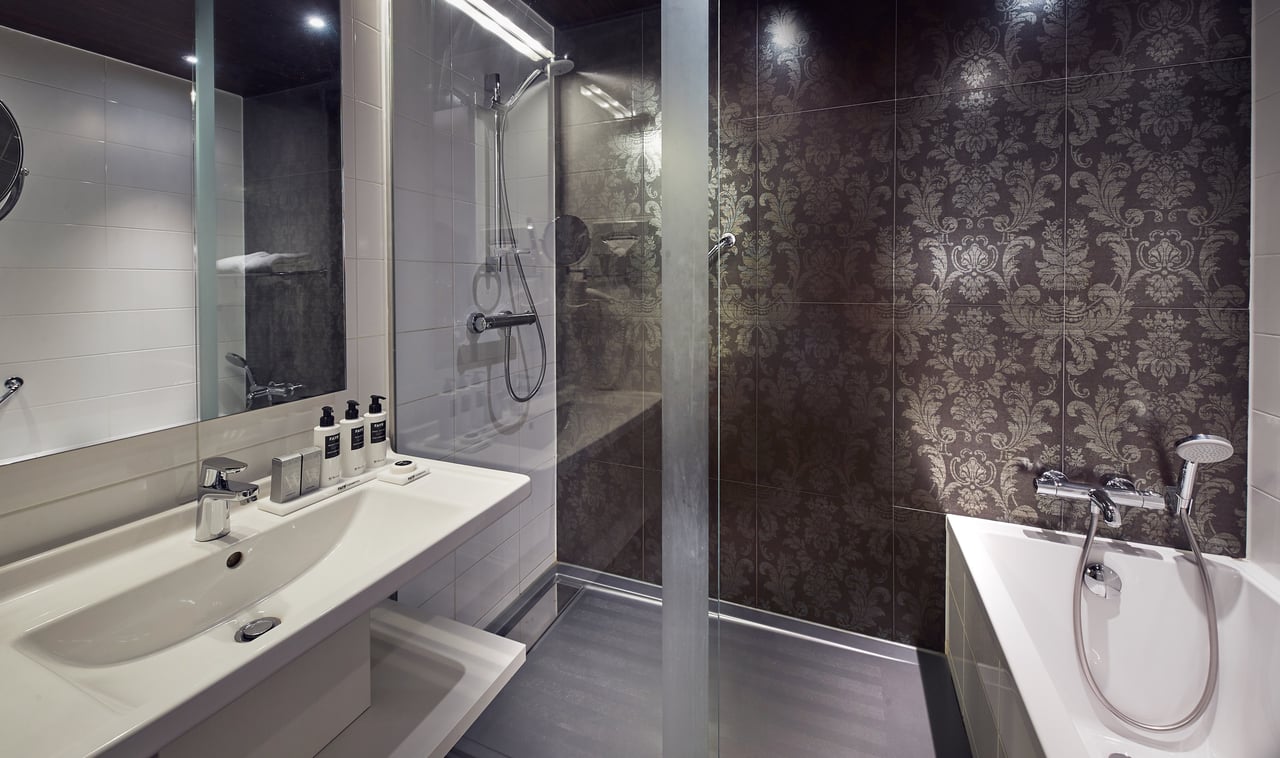 Westcord Fashion Hotel - Bathroom - Bath and Shower.jpg