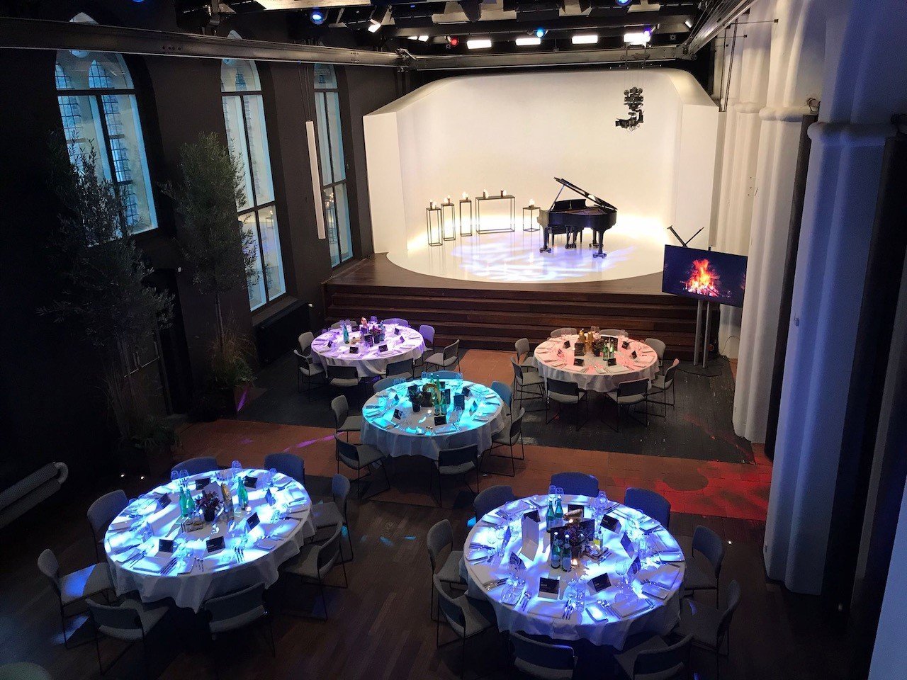 Main hall dinner setting with round tables